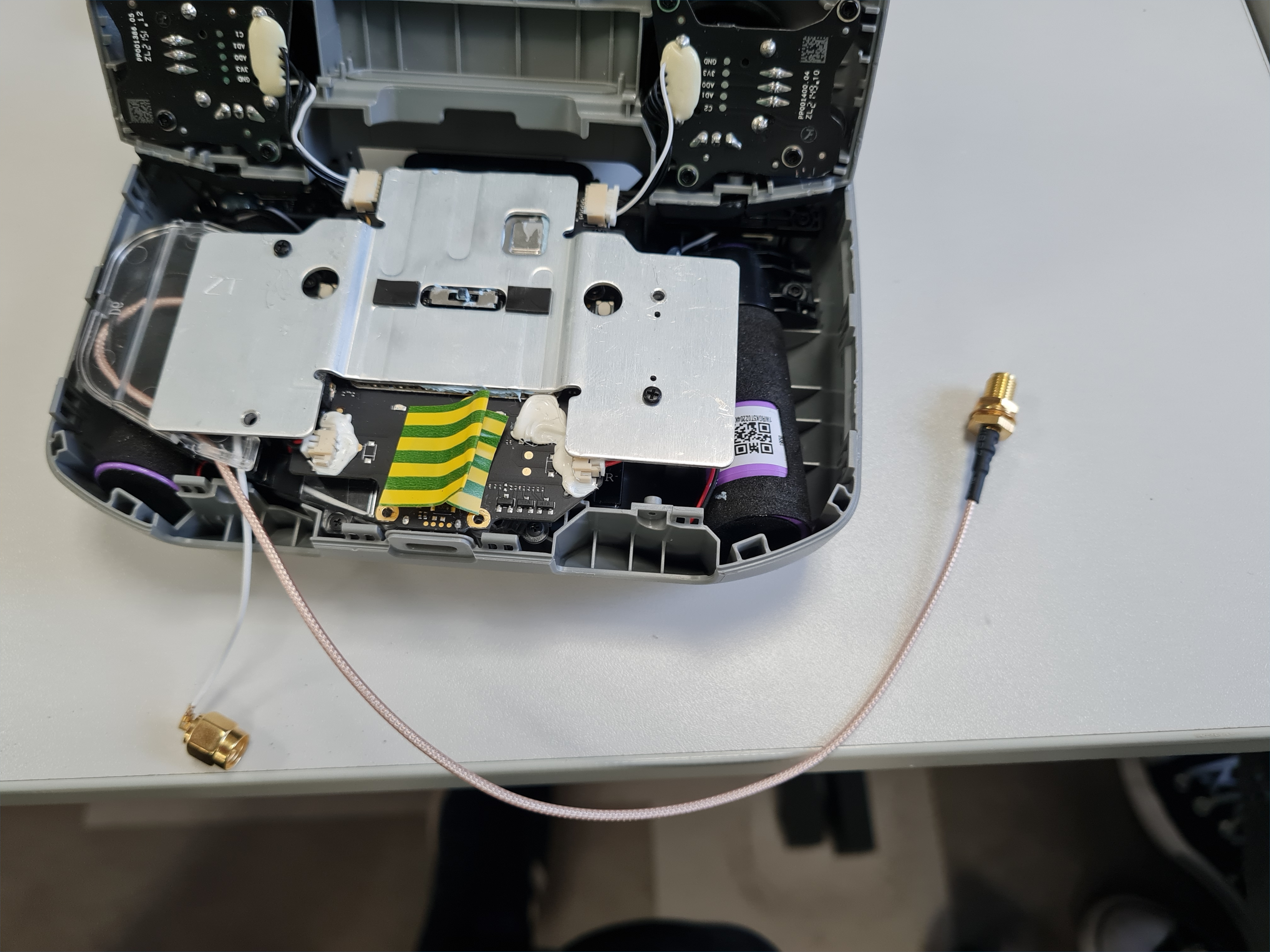 Internals of DJI drone remote controller, with SMA tails for antennae on board (image reproduced from our report)